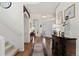 Inviting entryway with hardwood floors, elegant decor, and a view of the staircase and front door at 1011 S Valentia St # 121, Denver, CO 80247