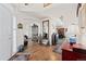 Spacious entryway featuring hardwood floors, white walls, and an open floor plan leading to formal dining and living areas at 1011 S Valentia St # 121, Denver, CO 80247
