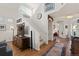 Inviting entryway with hardwood floors, staircase, and stylish decor at 1011 S Valentia St # 121, Denver, CO 80247