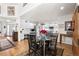 Open-concept kitchen with white cabinets and island, flowing into dining area at 1011 S Valentia St # 121, Denver, CO 80247