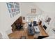Open living room with hardwood floors, high ceilings, fireplace, and plenty of natural light at 1011 S Valentia St # 121, Denver, CO 80247
