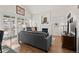 Cozy living room with a fireplace, vaulted ceilings, large windows, and a comfortable sofa at 1011 S Valentia St # 121, Denver, CO 80247