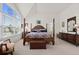 Large main bedroom with a four poster bed, vaulted ceilings, and natural light at 1011 S Valentia St # 121, Denver, CO 80247