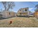 Large backyard featuring a detached garage and covered patio at 1805 W Stoll Pl, Denver, CO 80221