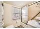 Bathroom features a shower and window for natural light at 1805 W Stoll Pl, Denver, CO 80221