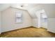 View of bedroom with two windows and wall to wall carpet at 1805 W Stoll Pl, Denver, CO 80221