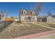 Charming home featuring stone accents and a covered carport for convenient parking at 1805 W Stoll Pl, Denver, CO 80221