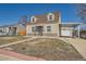 Charming home featuring stone accents and a covered carport with garage at 1805 W Stoll Pl, Denver, CO 80221