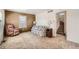 Cozy living room featuring classic furniture and staircase access at 1805 W Stoll Pl, Denver, CO 80221