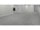 Spacious finished basement with neutral carpet and baseboards offers a versatile living space at 2203 S Harlan St, Denver, CO 80227