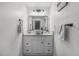Well-lit bathroom with a contemporary vessel sink, modern fixtures, and minimalist decor at 2203 S Harlan St, Denver, CO 80227