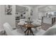 A beautifully staged dining room with modern decor and plenty of natural light at 2203 S Harlan St, Denver, CO 80227