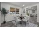 A beautifully staged dining room with modern decor and plenty of natural light at 2203 S Harlan St, Denver, CO 80227