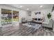 Inviting living room featuring a sliding door that provides seamless indoor-outdoor living at 2203 S Harlan St, Denver, CO 80227