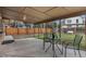 Relaxing covered patio with outdoor seating and a view of the fenced backyard at 2203 S Harlan St, Denver, CO 80227