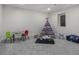 Charming playroom with gray carpet, play tent, colorful furniture, and ample space for activities at 2203 S Harlan St, Denver, CO 80227