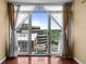 City view from a balcony featuring white framed sliding glass doors with sheer curtains at 2 Adams St # 1507, Denver, CO 80206