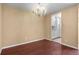 Dining room area featuring hardwood floors and a view into the kitchen at 2 Adams St # 1507, Denver, CO 80206