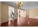 Open living space featuring hardwood floors, bright lighting, and easy access to the kitchen and outdoor patio at 2 Adams St # 1507, Denver, CO 80206