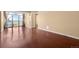 Spacious living room featuring hardwood floors, large window, and great natural light at 2 Adams St # 1507, Denver, CO 80206