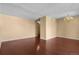 Empty living room area featuring hardwood floors and neutral-colored walls at 2 Adams St # 1507, Denver, CO 80206