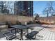 Inviting outdoor patio area with barbecue grill and picnic tables, perfect for outdoor entertaining and gatherings at 2 Adams St # 1507, Denver, CO 80206
