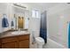 Clean bathroom with shower/tub combo, vanity, and toilet at 9673 Ironton St, Commerce City, CO 80022