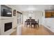 Bright dining room with hardwood floors and a wooden table with chairs at 9673 Ironton St, Commerce City, CO 80022