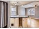 Kitchen island with eat-in bar provides counter space and connection to other living spaces at 1780 Oswego St, Aurora, CO 80010