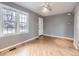 Bright living room features hardwood floors, neutral paint, and natural light from large windows at 1780 Oswego St, Aurora, CO 80010