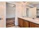Bright bathroom featuring a double sink vanity, and wood-look flooring at 8750 Redwing Ave, Littleton, CO 80126