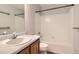 Clean bathroom featuring a shower and bath combination and a light wood vanity at 8750 Redwing Ave, Littleton, CO 80126