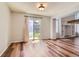 This dining room has access to the backyard through sliding glass doors and hardwood flooring at 8750 Redwing Ave, Littleton, CO 80126