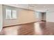Expansive living room featuring hardwood floors, recessed lighting, and neutral walls at 8750 Redwing Ave, Littleton, CO 80126