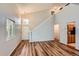 This living room features an open-concept design with wood floors and updated paint at 8750 Redwing Ave, Littleton, CO 80126