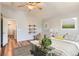 Spacious main bedroom featuring wood floors, a vaulted ceiling, and decoratively appointed walls at 8750 Redwing Ave, Littleton, CO 80126
