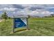 Province Center Park sign with playground and houses in the background at 8750 Redwing Ave, Littleton, CO 80126