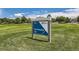 Kline Homestead Park entrance sign surrounded by lush green grass and trees at 8750 Redwing Ave, Littleton, CO 80126
