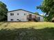 View of the backyard with a deck and sliding glass doors at 15908 E Flora Pl, Aurora, CO 80013