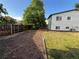 Spacious backyard features a wood fence, grass and trees offering privacy at 15908 E Flora Pl, Aurora, CO 80013