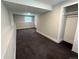Basement with plush carpet, neutral walls, natural light, and a closet for added storage at 15908 E Flora Pl, Aurora, CO 80013