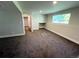 Finished basement featuring plush carpeting, natural light, and a nook at 15908 E Flora Pl, Aurora, CO 80013