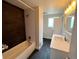 Modern bathroom with dual-tone tile, shower and a stylish vanity at 15908 E Flora Pl, Aurora, CO 80013