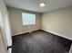 Empty bedroom featuring a window, neutral walls and carpeted floor at 15908 E Flora Pl, Aurora, CO 80013