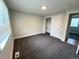 Bedroom with a window, closet and neutral carpet at 15908 E Flora Pl, Aurora, CO 80013
