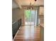 Dining area with access to the outdoor deck and modern light fixture at 15908 E Flora Pl, Aurora, CO 80013