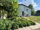 Exterior shot of a two-story home with brick accents and mature landscaping at 15908 E Flora Pl, Aurora, CO 80013