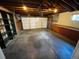 Open garage featuring storage shelves and workbench at 15908 E Flora Pl, Aurora, CO 80013
