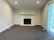 Spacious living room with a decorative fireplace and sliding glass doors at 15908 E Flora Pl, Aurora, CO 80013