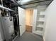 This utility room features built-in shelving and an open doorway, offering storage and access at 15908 E Flora Pl, Aurora, CO 80013